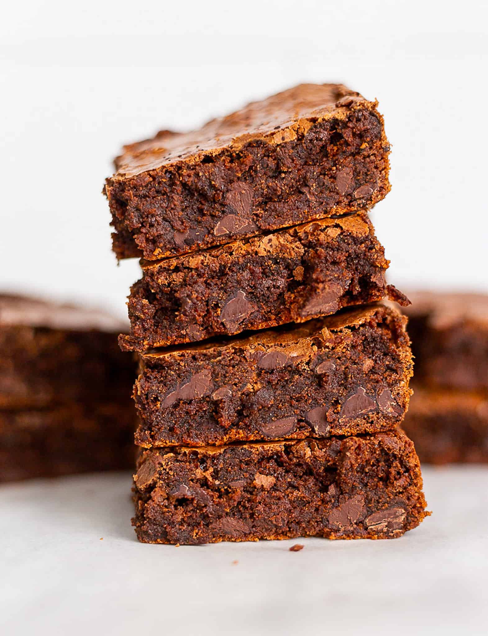 A stack of fudge brownies piled four high.