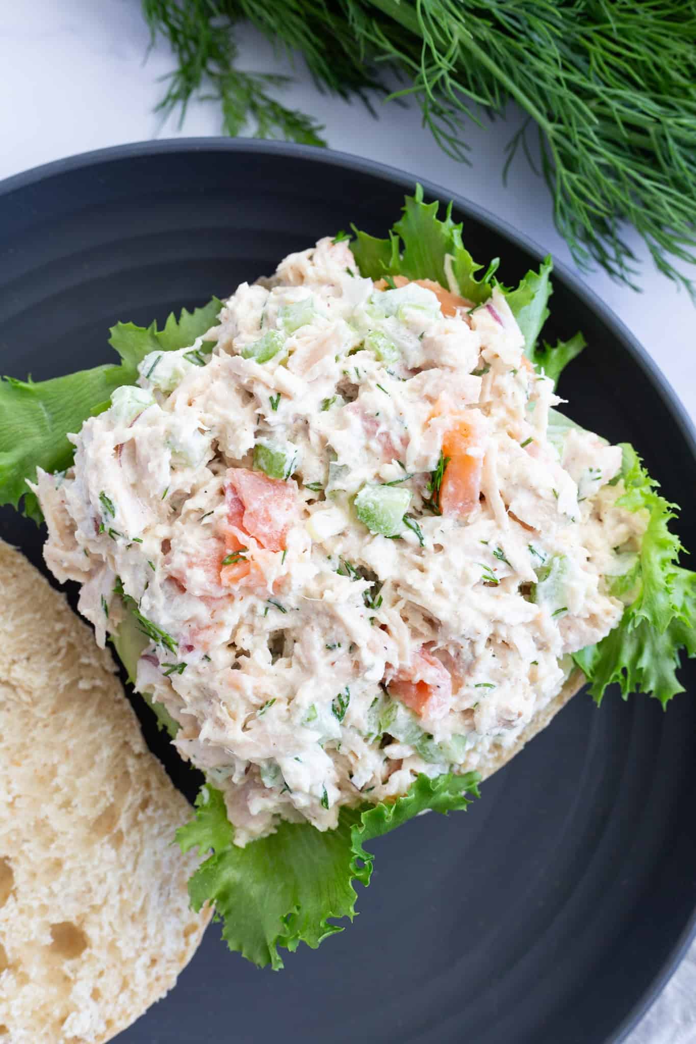 Smoked salmon tuna atop a bottom slice of Ciabatta bread.
