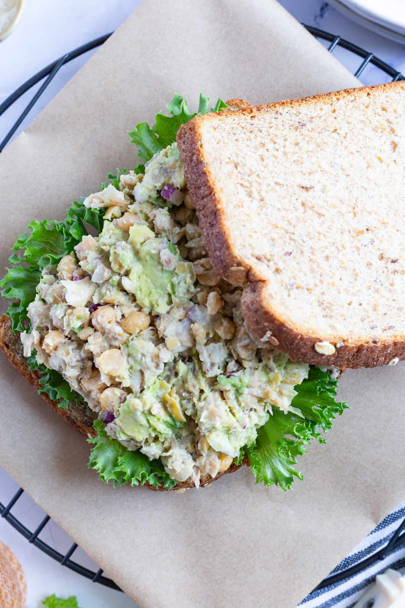 Smashed chickpeas, sardines, and avocado on bread.