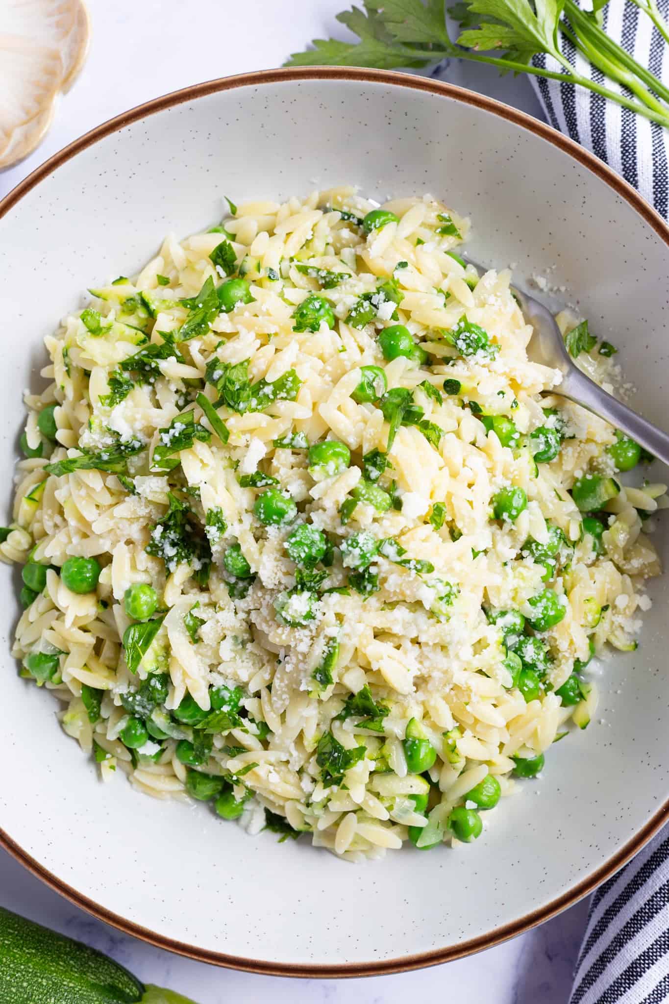 A bowl of lemon zucchini orzo.