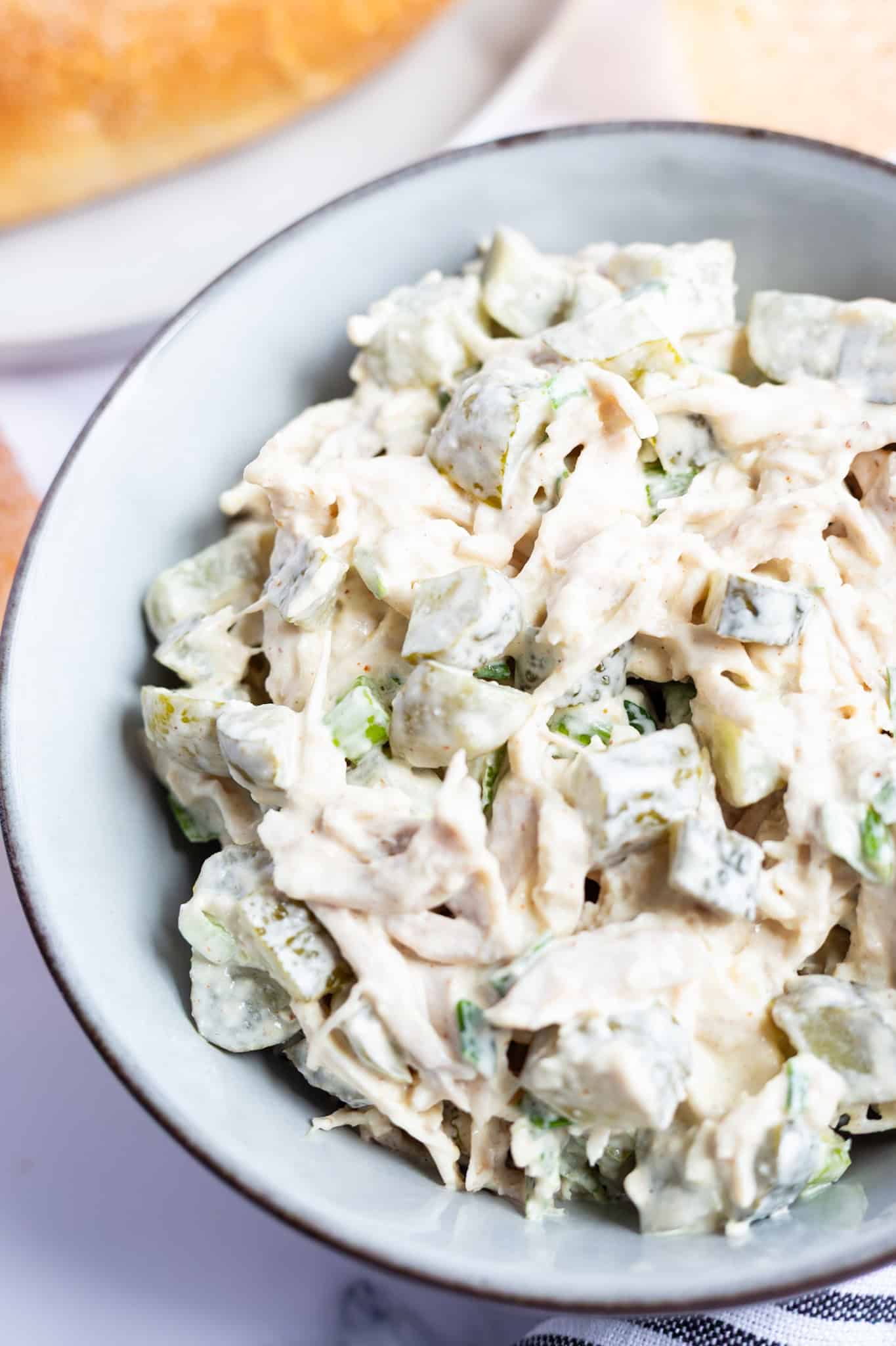 A bowl of creamy dill pickle chicken salad.
