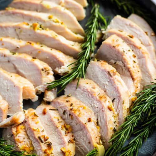 A platter of juicy roasted boneless turkey breast.