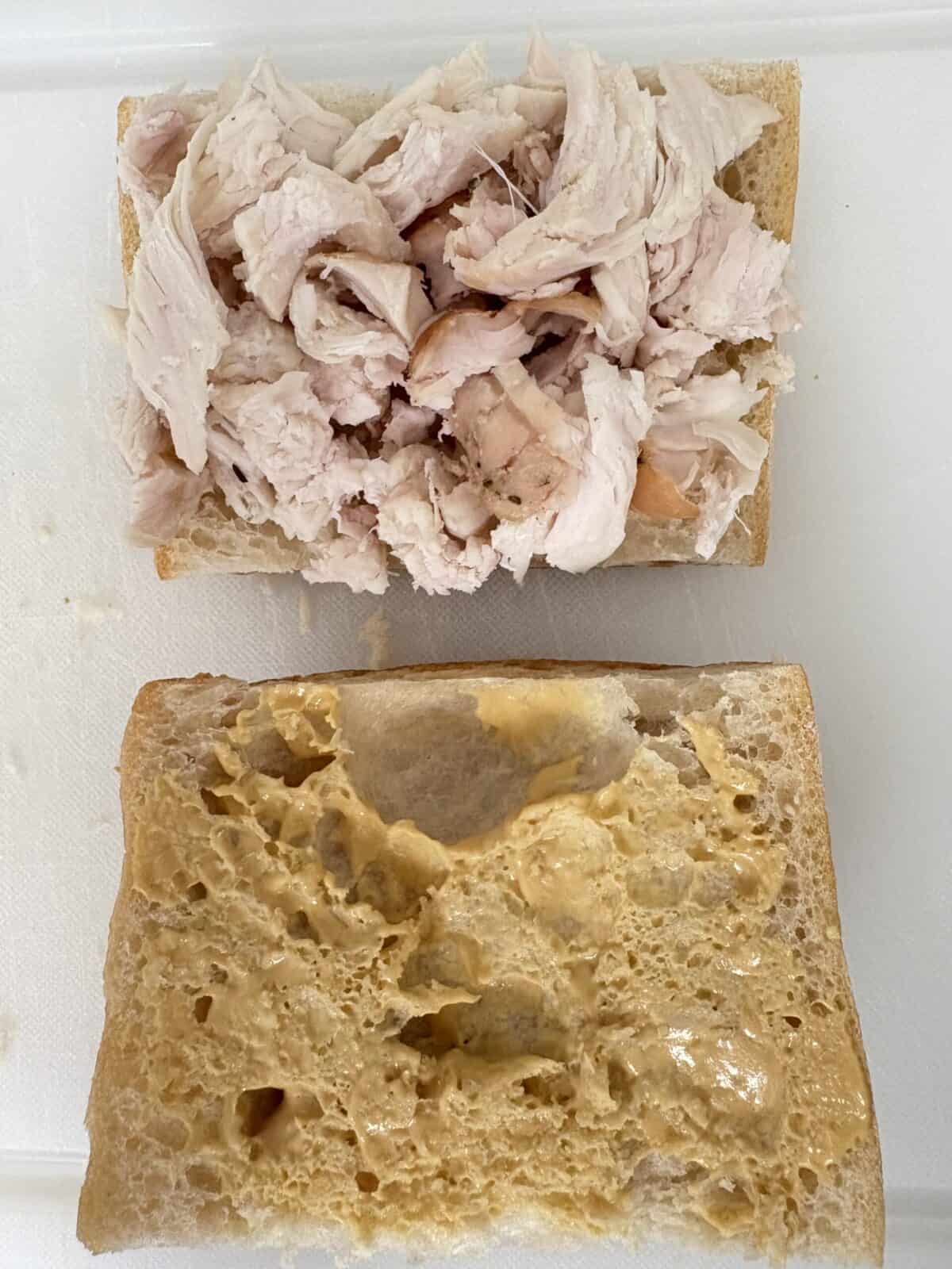 A slice of bread with turkey.