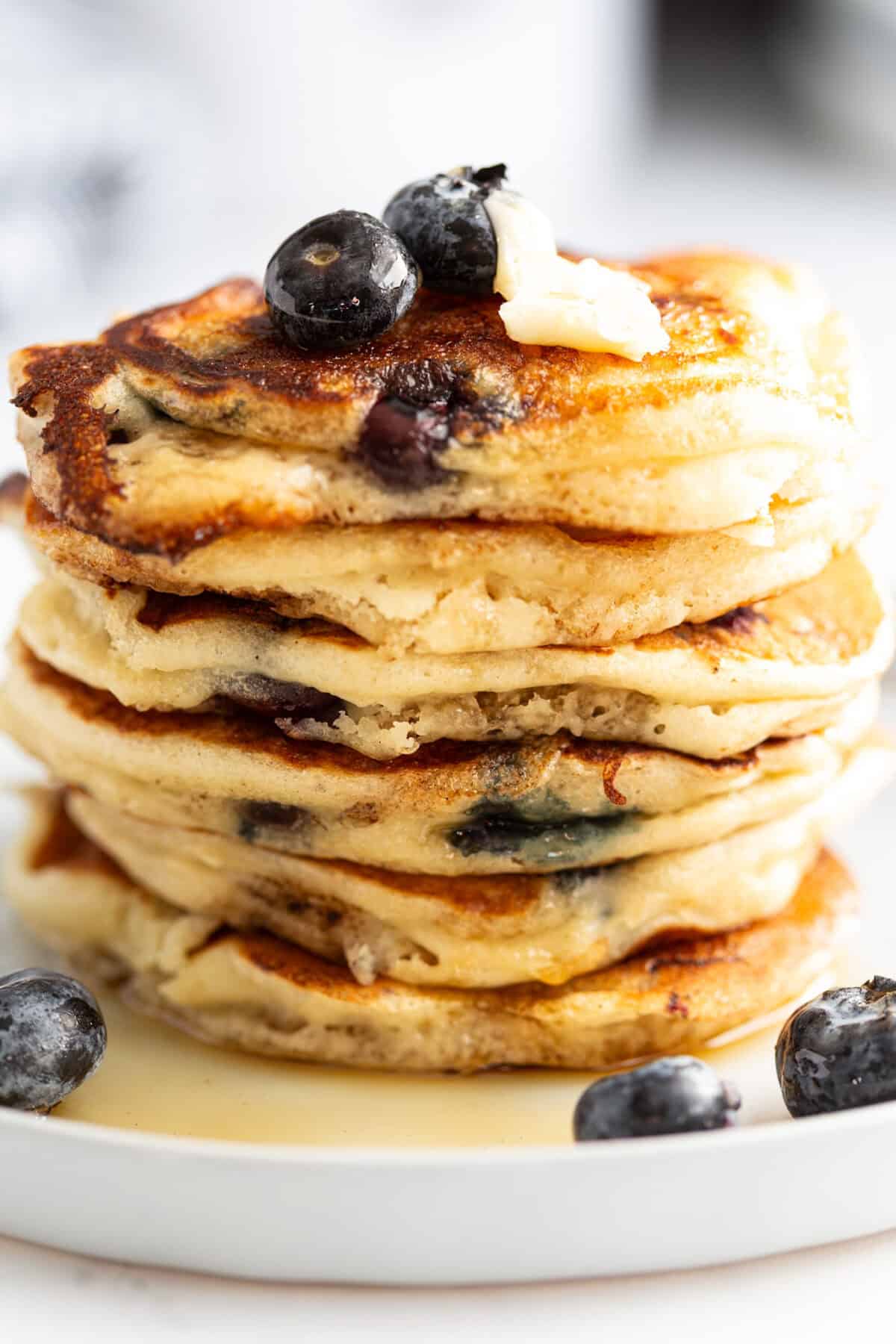 A stack of moist blueberry pancakes.