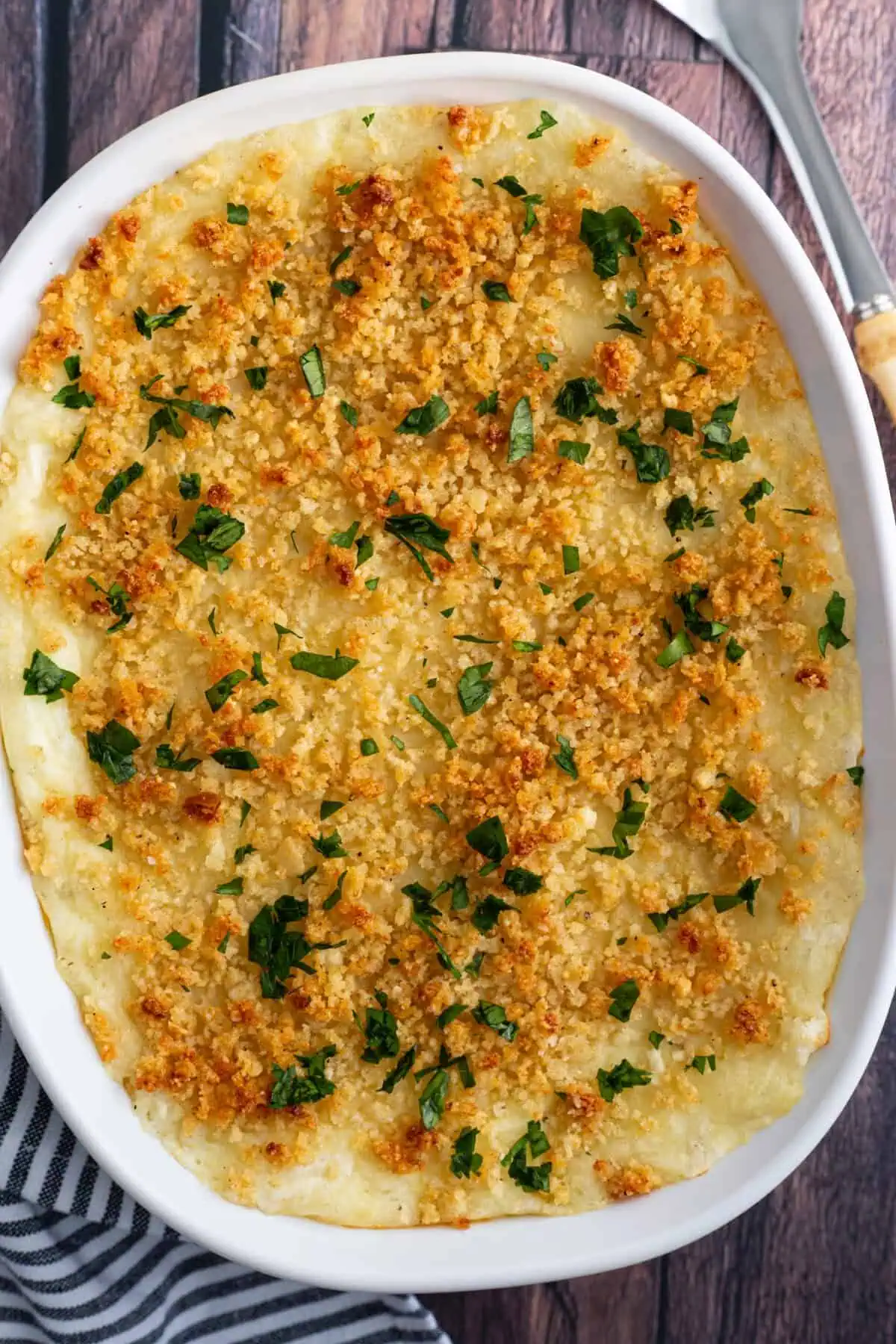 A casserole dish of Italian baked mashed potatoes.