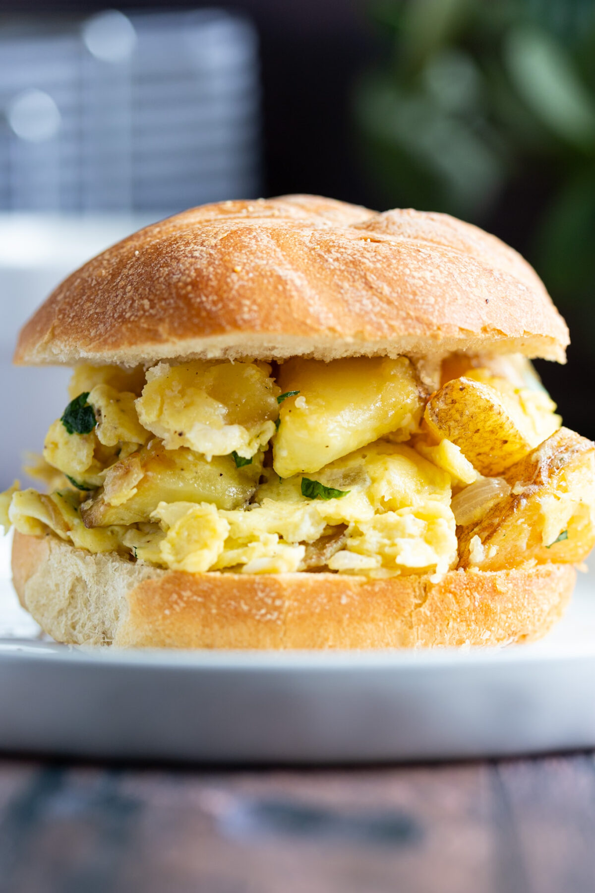 A sandwich roll stuffed with Italian potatoes and eggs.