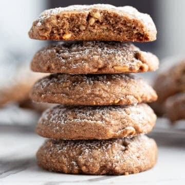 A stack of almond cocoa powder cookies.