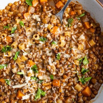 A bowl of lentil and ditalini soup.
