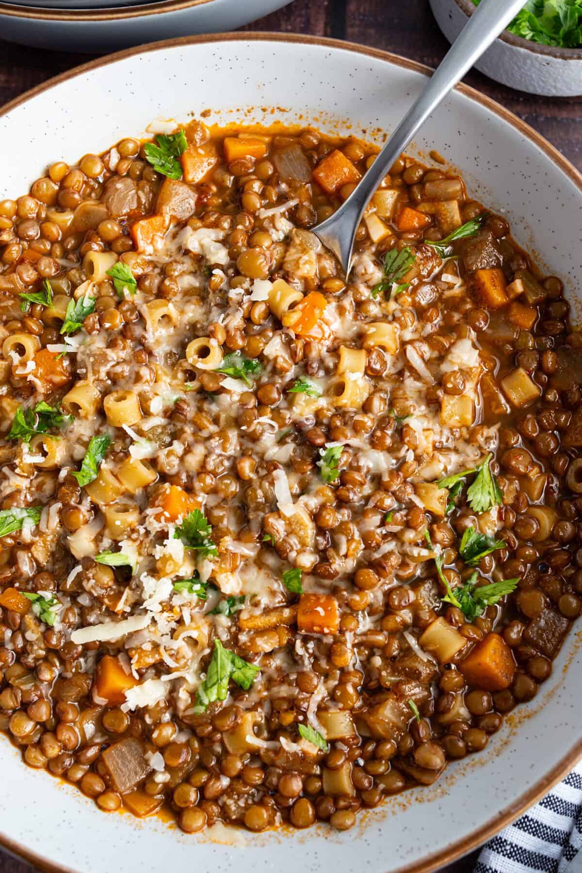 A bowl of lentil and ditalini soup.