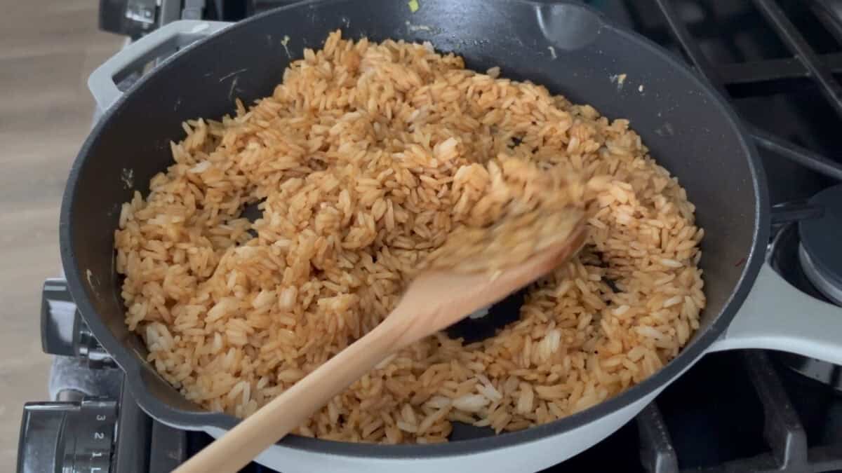 A pan of cooked rice in soy sauce.