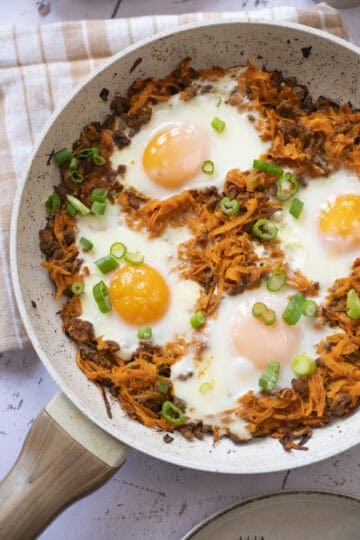 A pan of baked eggs with chorizo and sweet potato.