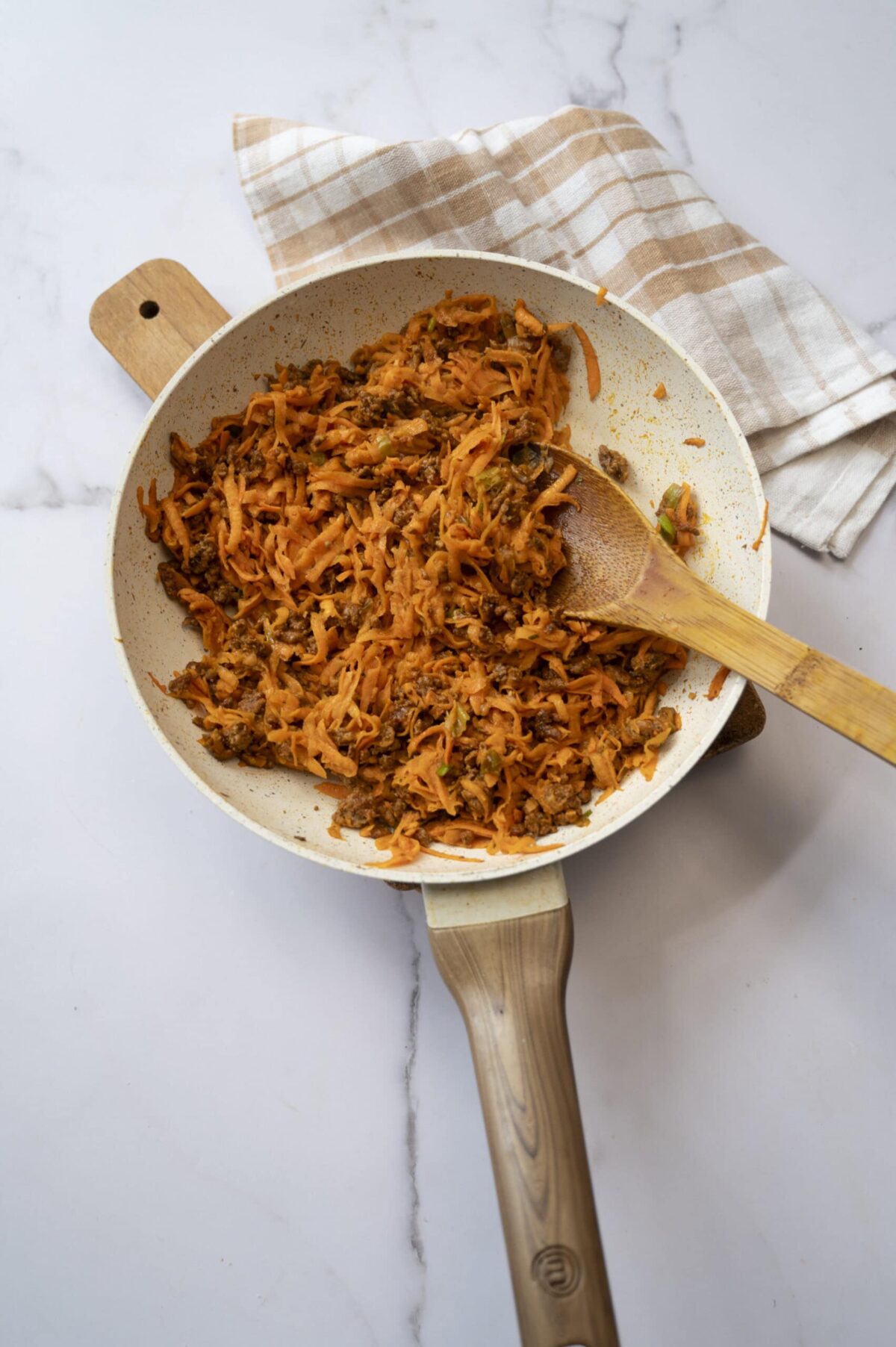 Cooked shredded sweet potato and chorizo.