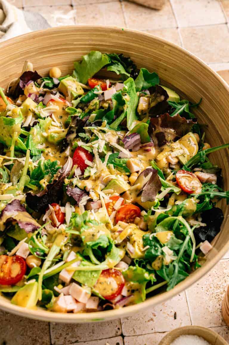 A salad with smoked turkey and cheddar.