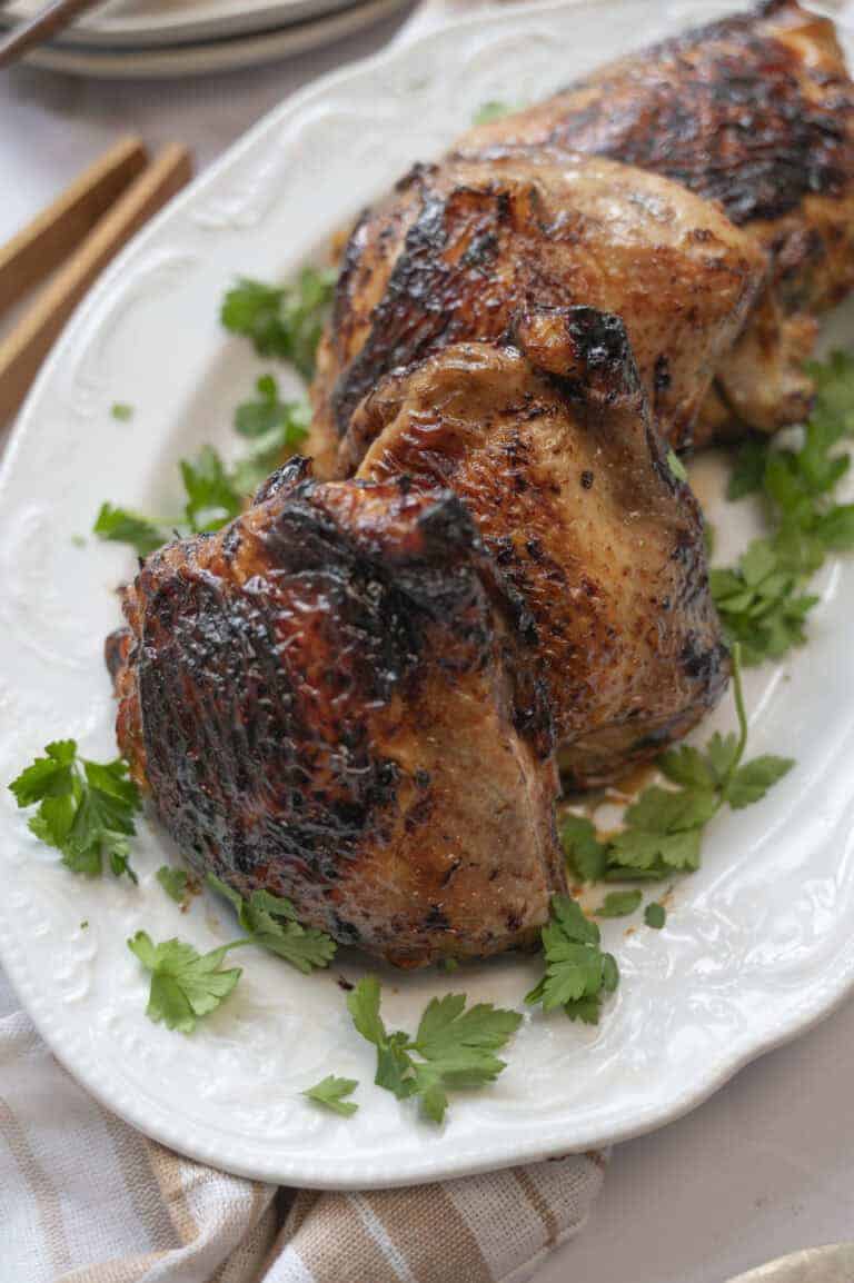 A plate of juicy chicken thighs.