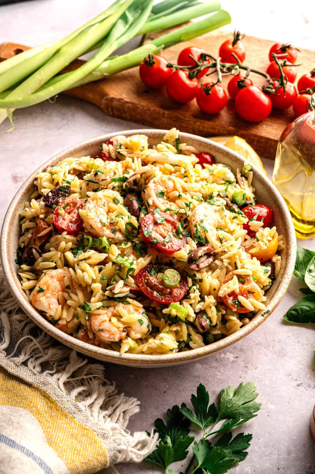A bowl of Mediterranean orzo pasta with shrimp.