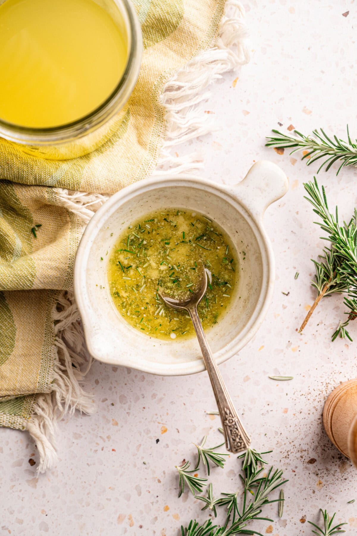 Melted butter with rosemary and garlic.
