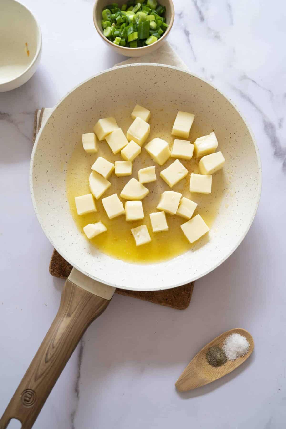 A pan with cubed mozzarella.