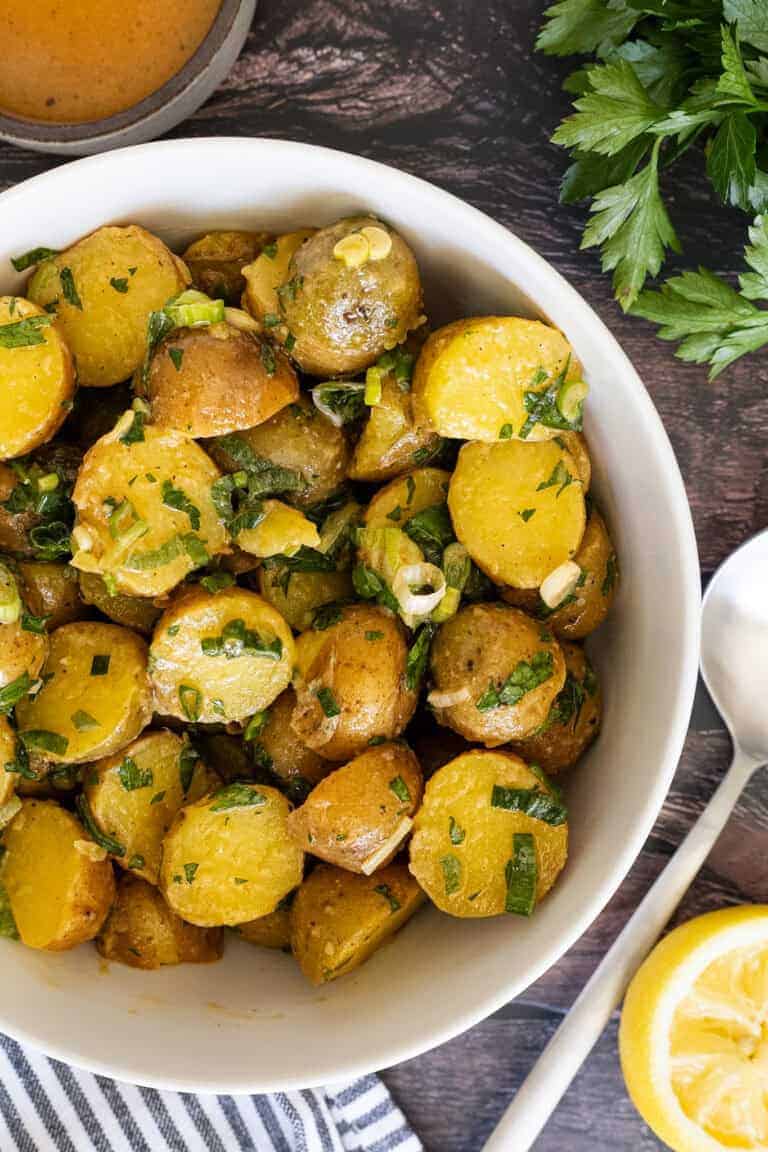 Potato salad with scallions and parsley.