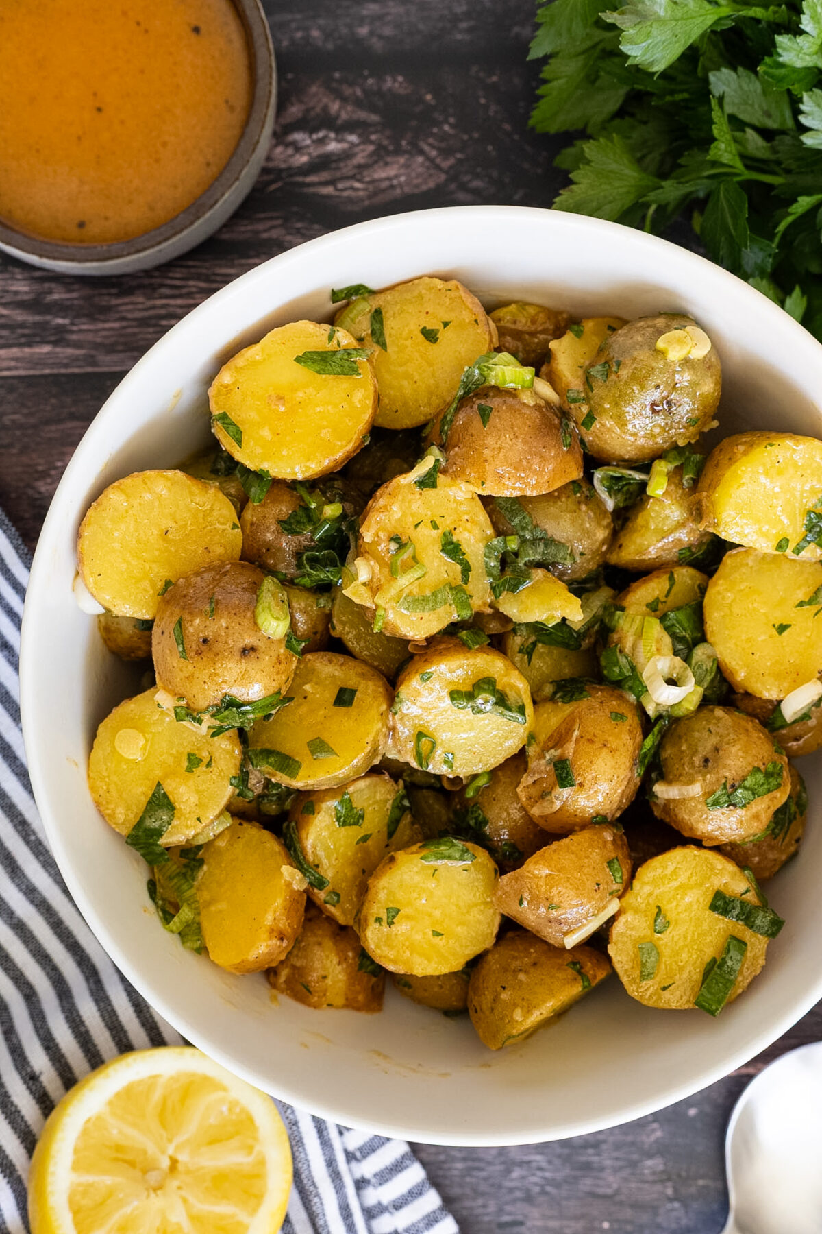 A bowl of herby potato salad.