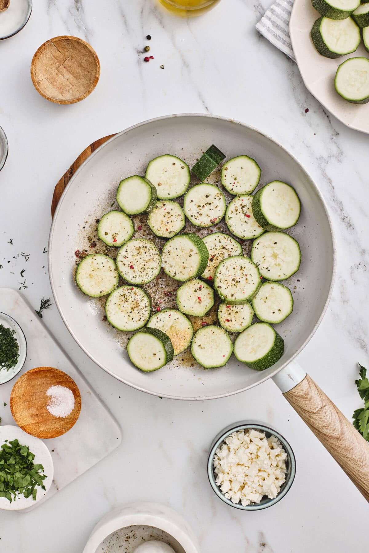 Sliced zucchini in a pan.
