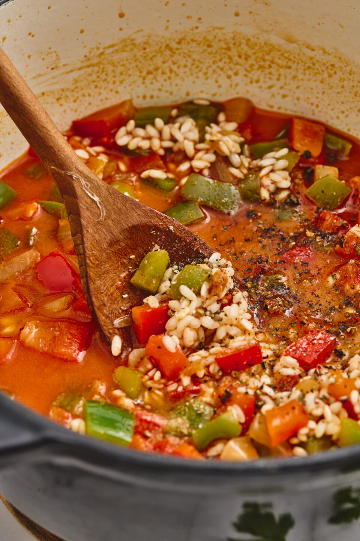 Rice simmering in broth.