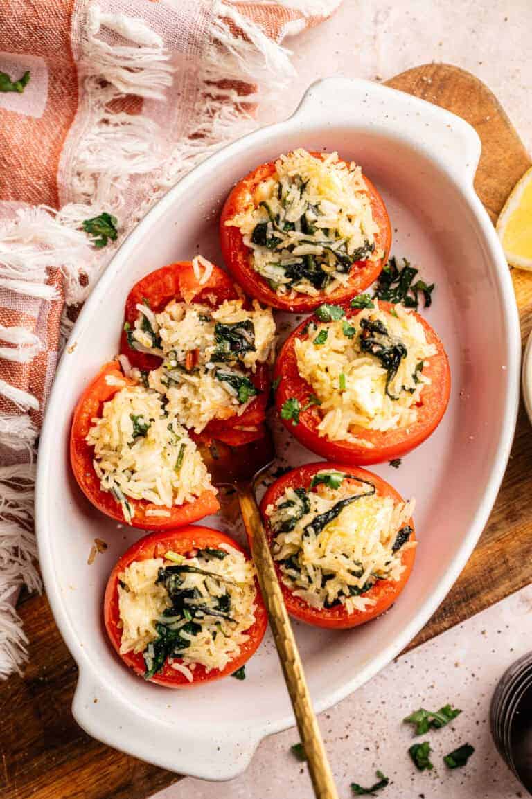 Five tomatoes stuffed with rice and feta.