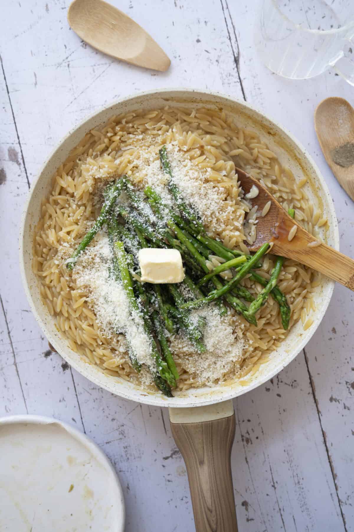 Orzo tossed with asparagus tips, butter, and Pecorino.