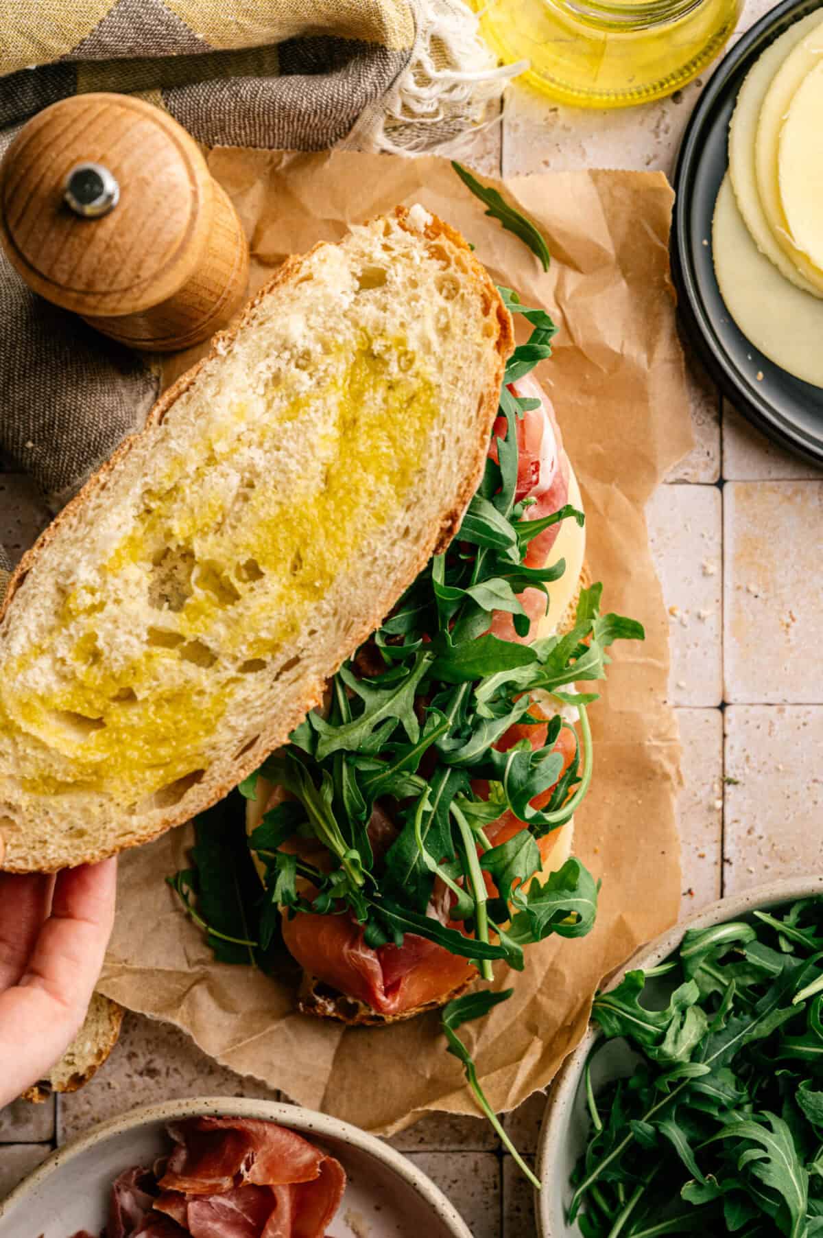 An assembled prosciutto sandwich.