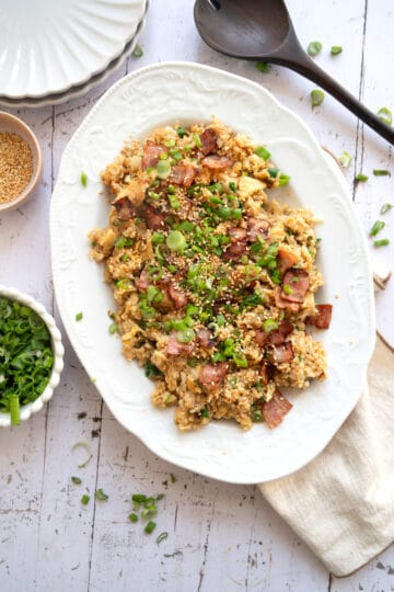 A large platter of bacon and egg fried rice.