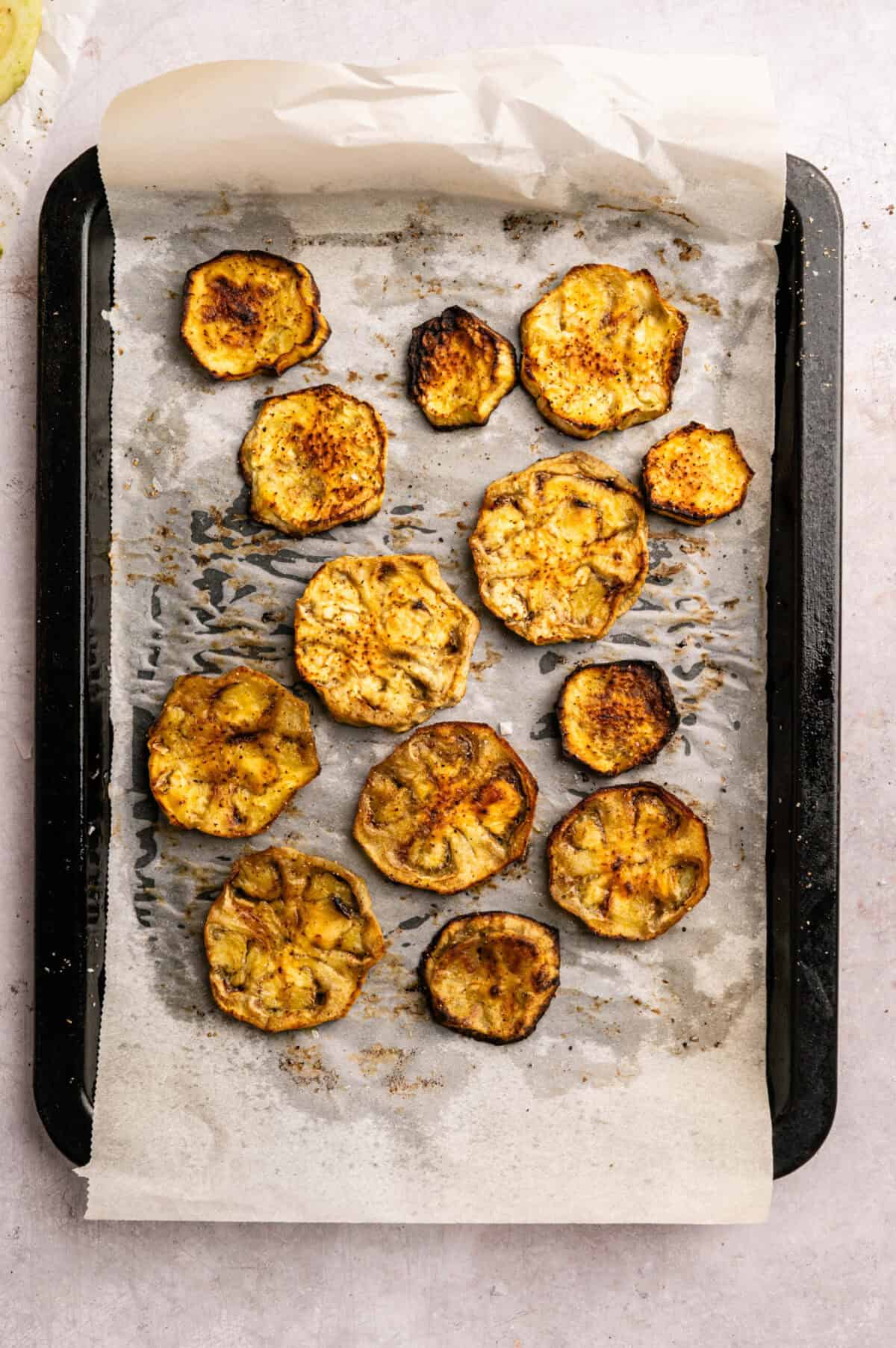 A pan of roasted eggplant slices.