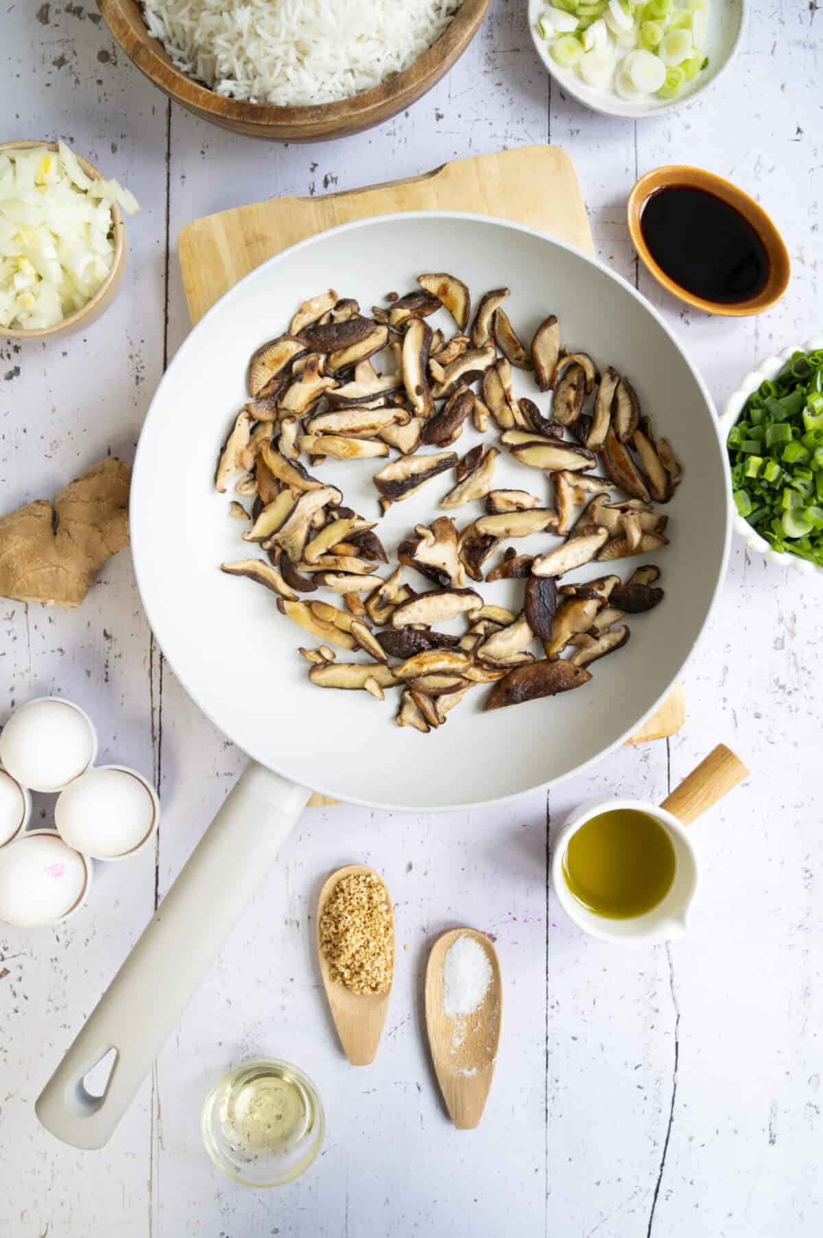 A pan of sauteed shiitake mushrooms.