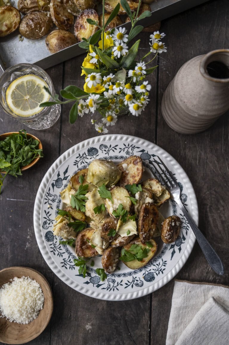 Creamy baked artichoke hearts and potatoes.