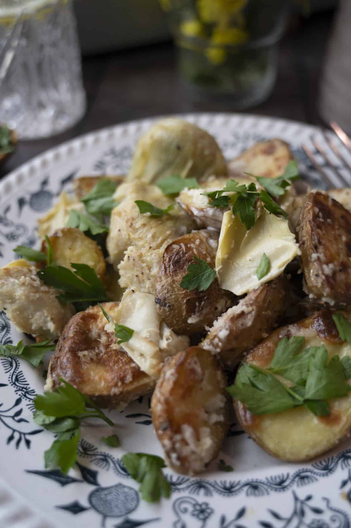 A plate of potatoes and artichokes.