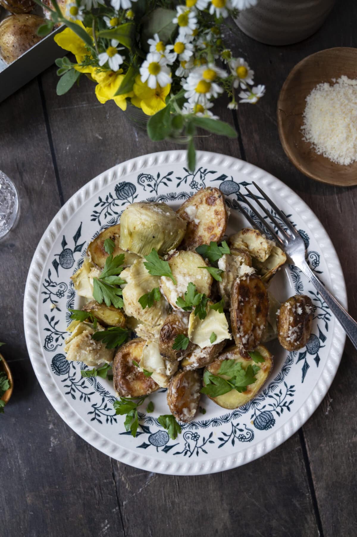 Baked baby potatoes and artichoke hearts.