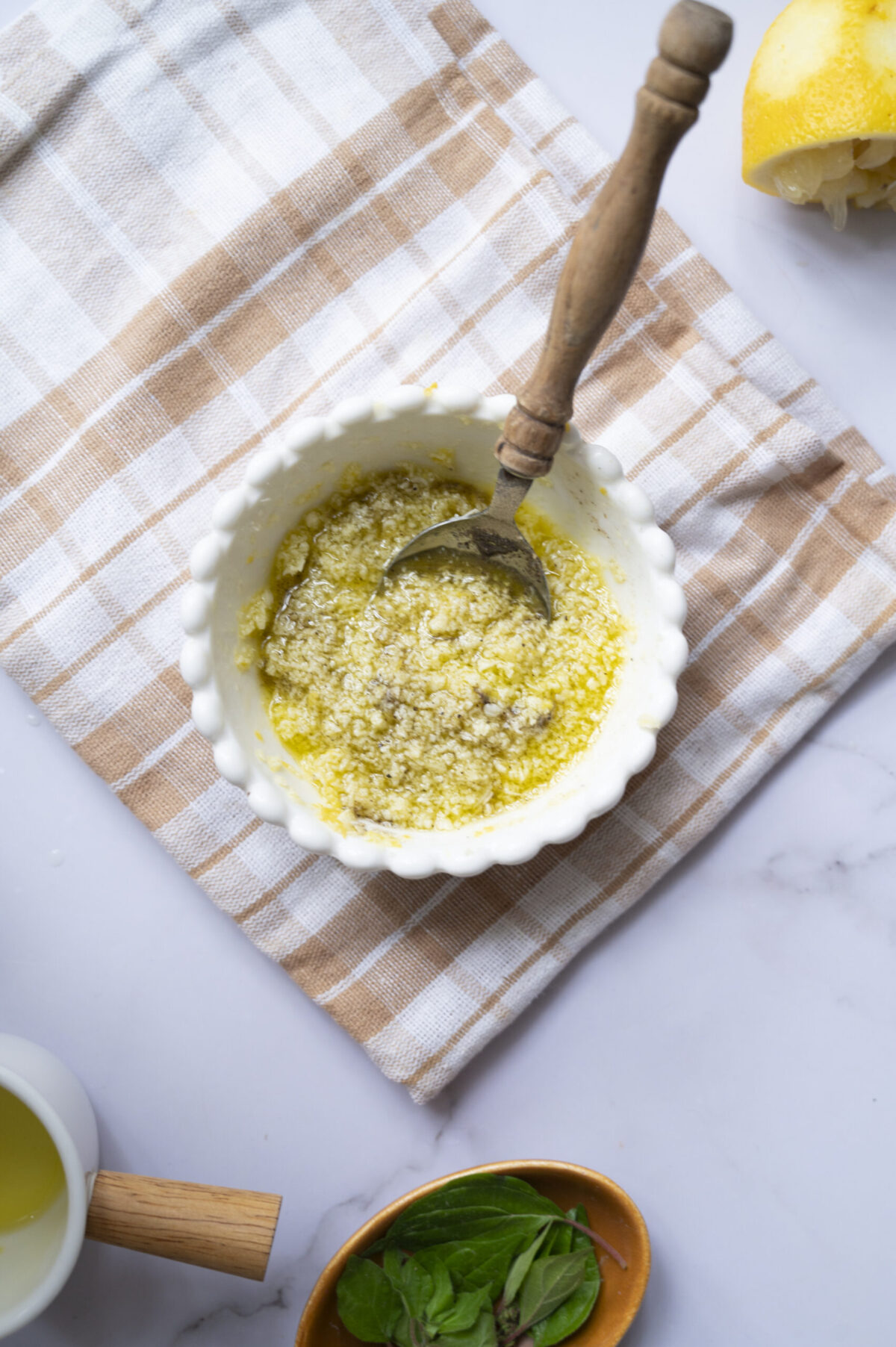 A small bowl of olive oil mixed with lemon juice, lemon zest, and Pecorino.