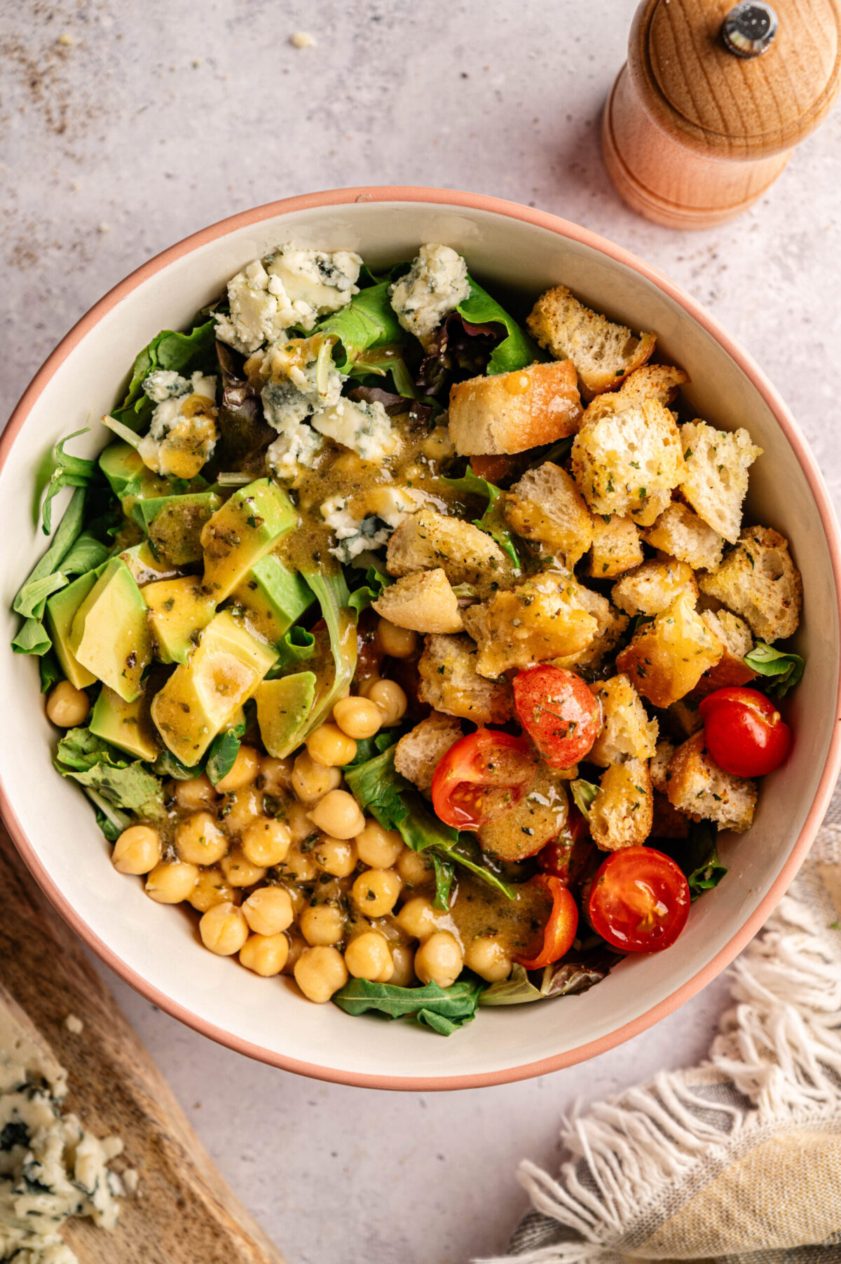 A blue cheese salad dressed with vinaigrette for tossing.