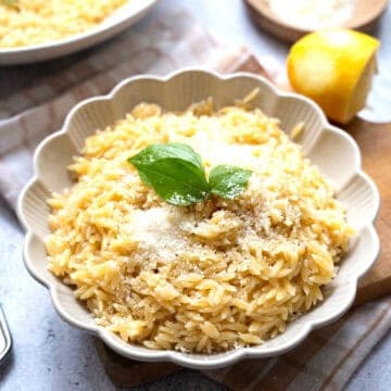 A bowl of lemon orzo dusted with Pecorino.