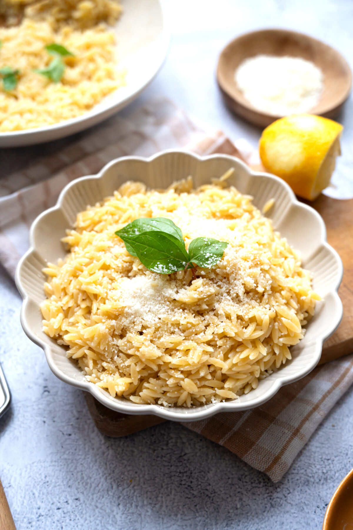 A bowl of lemon orzo dusted with Pecorino.