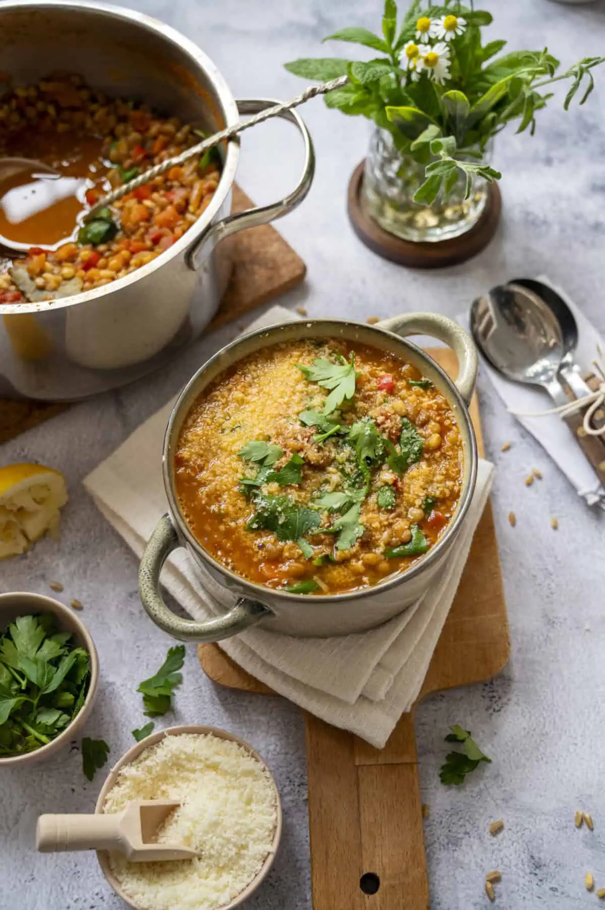 A cheesy bowl of lentil and barley soup.
