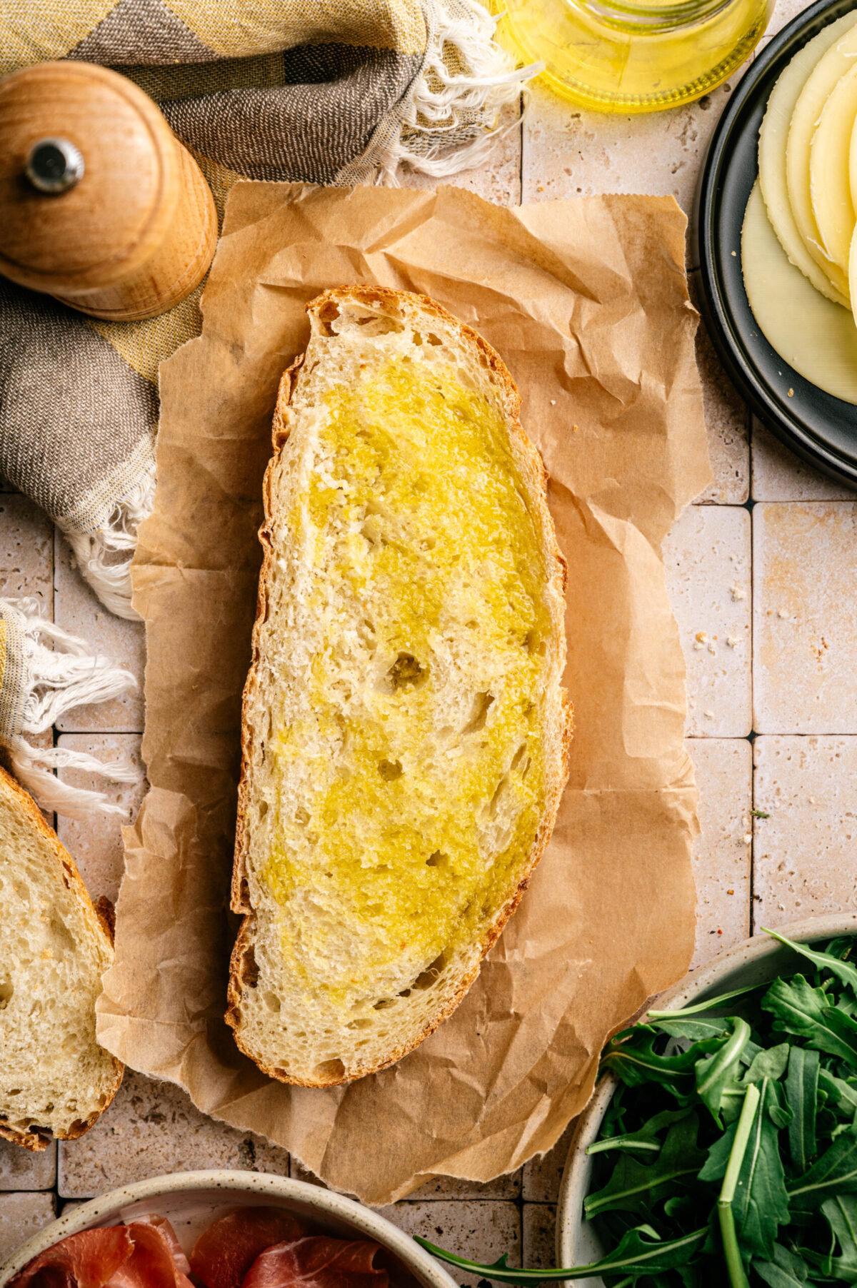 A slice of bread brushed with olive oil.