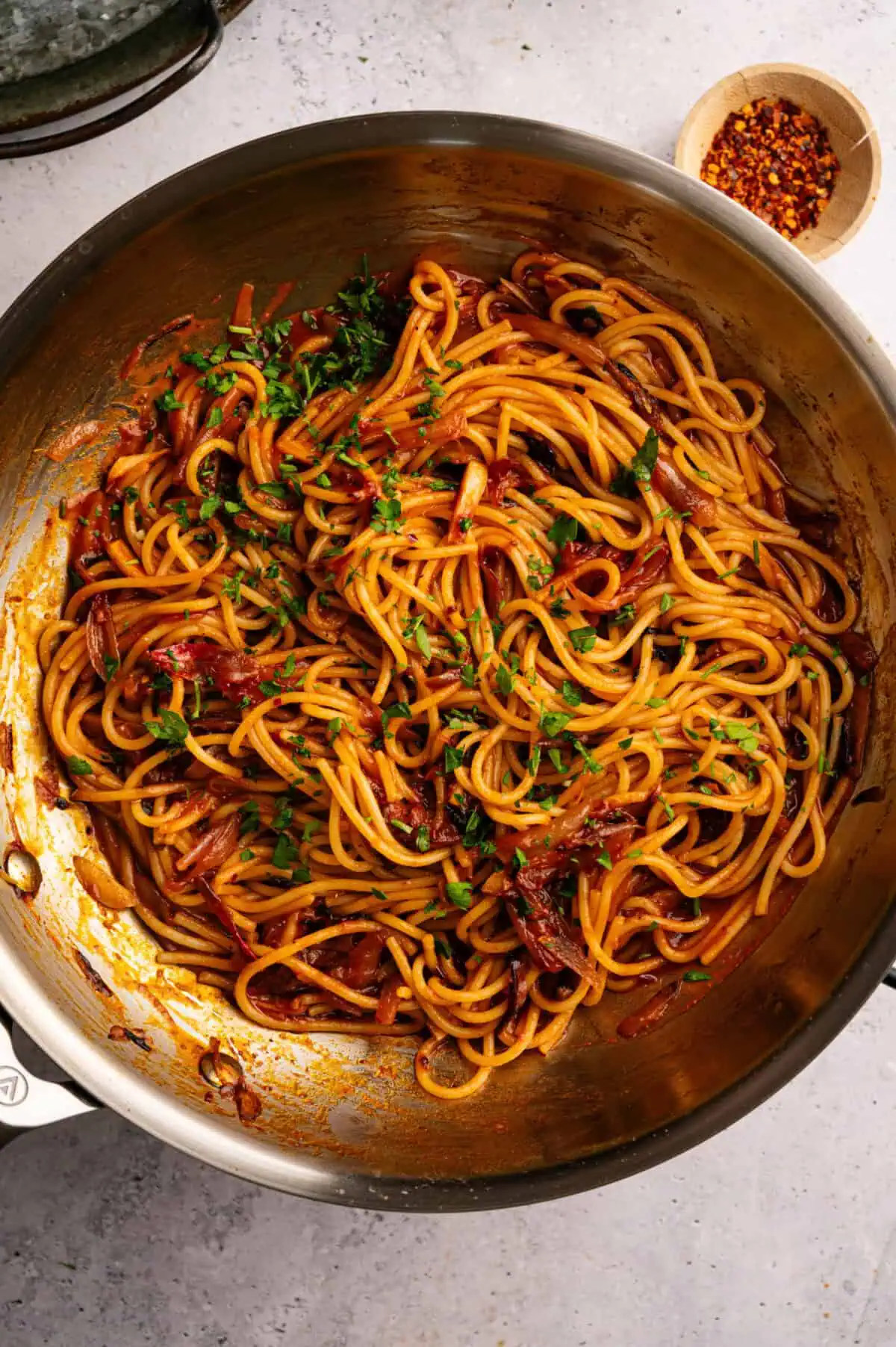 A pan of caramelized shallot pasta.