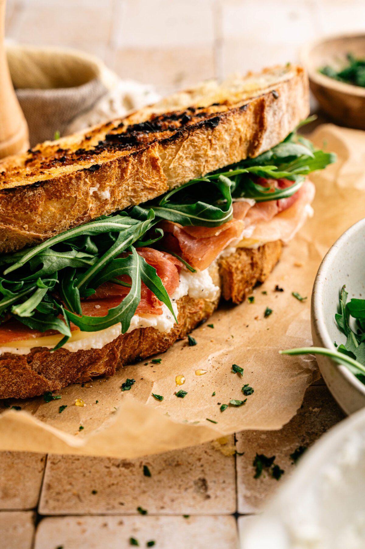 A panini stuffed with cheese and prosciutto.