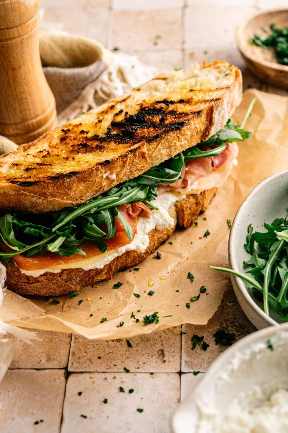 A panini stuffed with prosciutto and provolone.
