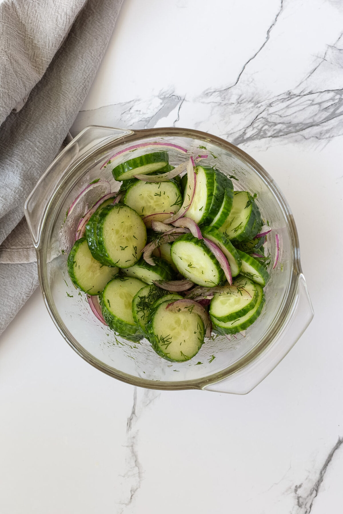 Cucumbers and dill tossed with vinegar dressing.