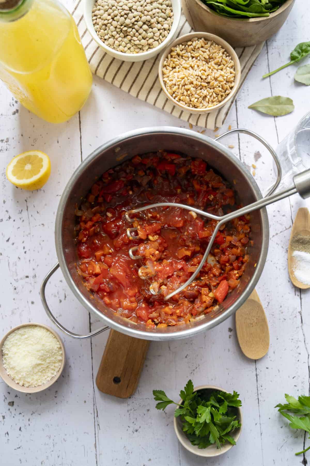 A pot of veggies and fire-roasted tomatoes for soup.