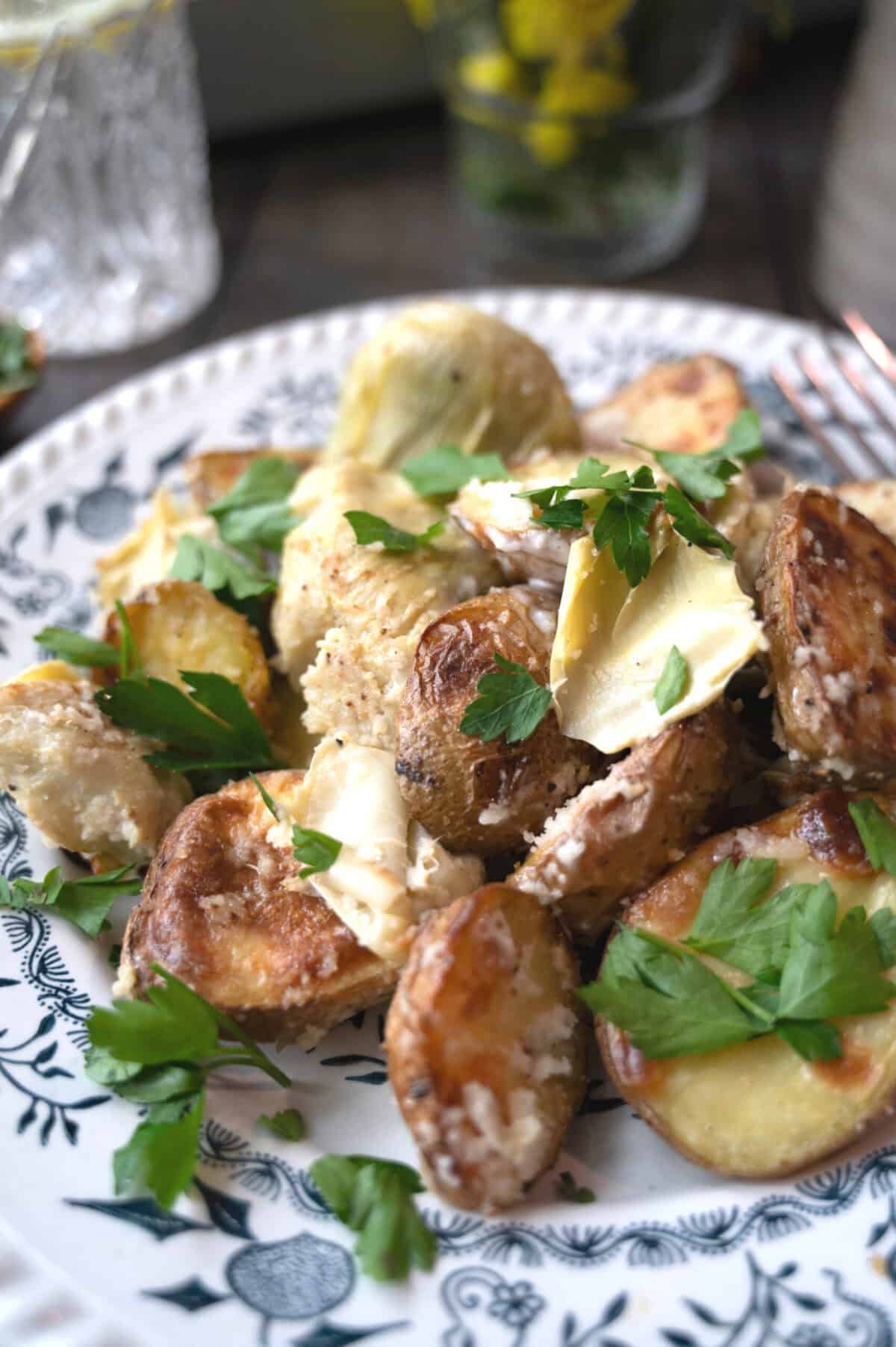 A plate of creamy artichoke hearts and potatoes.