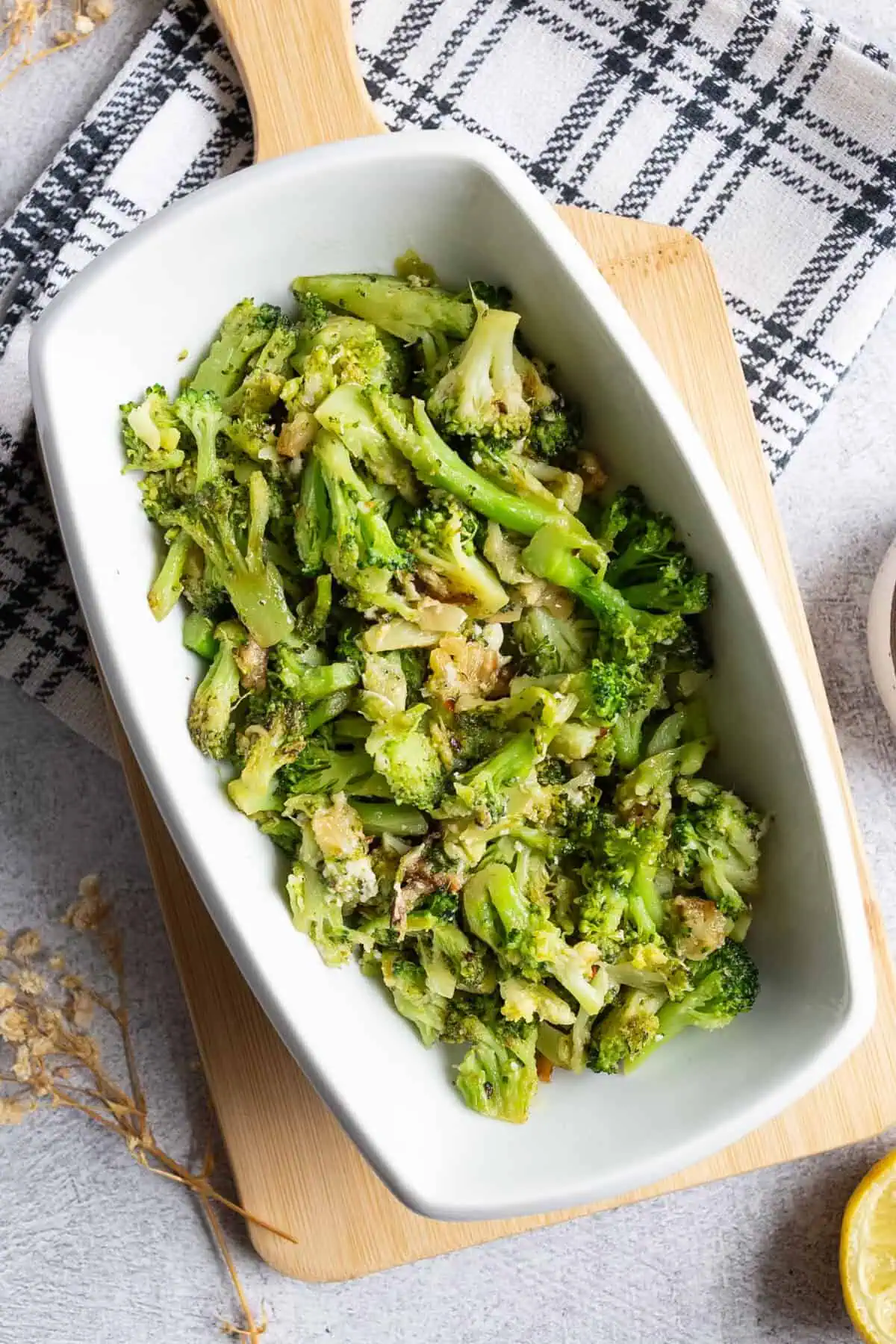 A platter of broccoli with roasted garlic and pecorino.