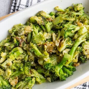 A platter of broccoli with roasted garlic and pecorino.