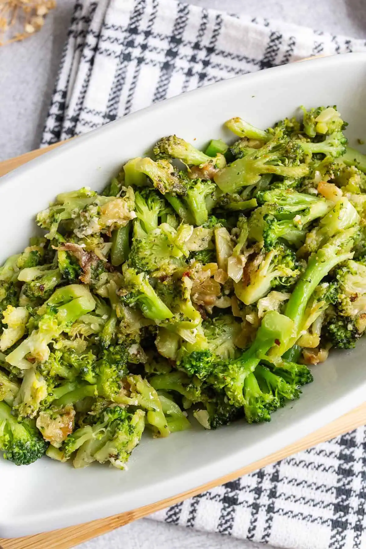 A platter of broccoli with roasted garlic and pecorino.