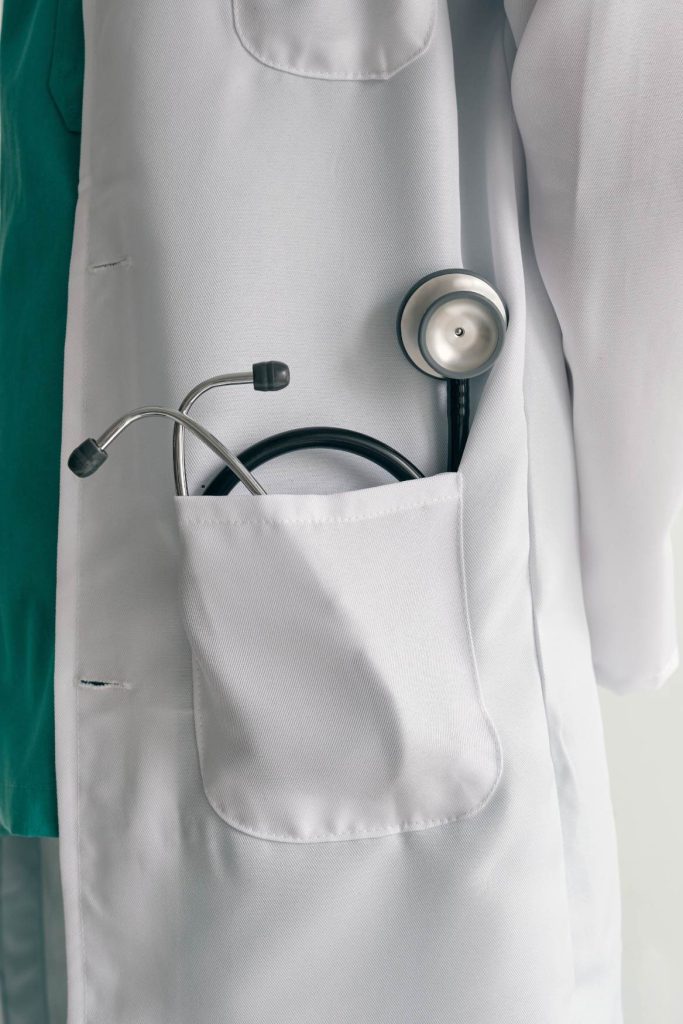 Doctor's white coat with stethoscope in pocket for healthcare services.